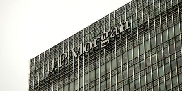 A logo sits on display outside the offices of JPMorgan Chase & Co. in the Canary Wharf business and shopping district in Lond