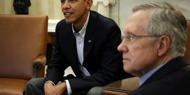 WASHINGTON, DC - OCTOBER 12: U.S. President Barack Obama (L) meets with Senate Democratic leadership, including Senate Majority Leader Sen. Harry Reid (D-NV) (R), to discuss the government shutdown and the nation's debt ceiling in the Oval Office of the White House October 12, 2013 in Washington, DC. The U.S. Government is on its 12th day of a shutdown. (Photo by Alex Wong/Getty Images)
