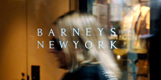UNITED STATES - MARCH 16: A Barneys New York logo is pictured as a woman enters their 5th Avenue store in New York, Tuesday,