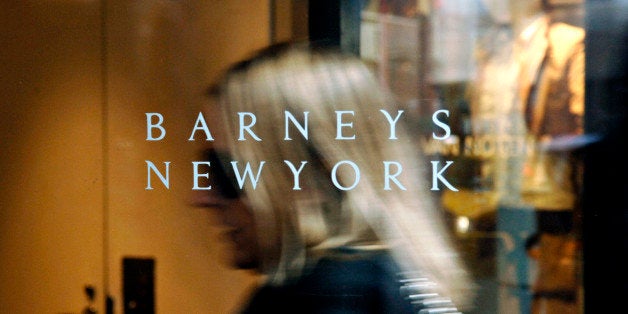 UNITED STATES - MARCH 16: A Barneys New York logo is pictured as a woman enters their 5th Avenue store in New York, Tuesday, March 21, 2006. Jones Apparel Group Inc., maker of Anne Klein clothes and owner of Barneys New York stores, put itself up for sale after profit fell for two consecutive years. The Bristol, Pennsylvania-based company hired Goldman Sachs Group Inc. as financial adviser. Jones Apparel said it won't divest any units amid speculation it planned to sell the Nine West shoe business. The shares rose as much as 15 percent, giving the company a market value of $3.99 billion. (Photo by Daniel Acker/Bloomberg via Getty Images)