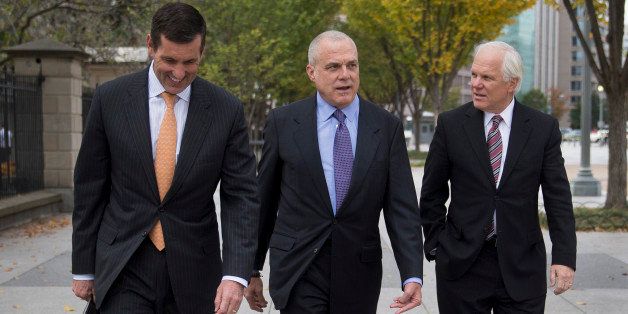 Bruce Broussard, chief executive officer of Humana Inc., from left, Mark Bertolini, chairman, president and chief executive officer of Aetna Inc., and Joseph 'Joe' Swedish, chief executive officer of Wellpoint Inc., walk towards the White House in Washington, D.C., U.S., on Wednesday, Oct. 23, 2013. Health insurance executives including WellPoint Inc. Chief Executive Officer Joseph Swedish will meet with top White House officials today as President Barack Obama seeks to contain political damage over the rollout of online enrollment for his health-care expansion. Photographer: Andrew Harrer/Bloomberg via Getty Images 
