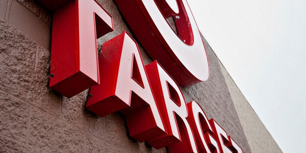 Rain falls on the Target Corp. logo displayed outside of a store in Peru, Illinois, U.S., on Thursday, Feb. 7, 2013. Target Corp. led U.S. retailers to the biggest monthly same-store sales gain in more than a year as shoppers snapped up discounted merchandise chains were clearing out after the holidays. Photographer: Daniel Acker/Bloomberg via Getty Images