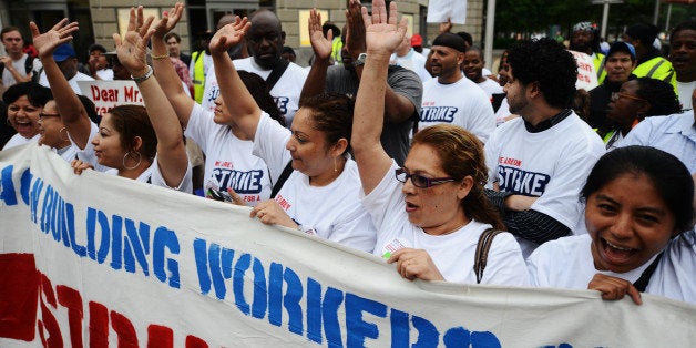 WASHINGTON, DC- MAY 21: A large group of low-wage workers gathered on Tuesday, May 21, in front of the Ronald Reagan Building on Pennsylvania Ave. to protest minimum wage standards in the United States. The group began their day in front of the Ronald Reagan building marching down the street and will make several stops along the way, ending at Union Station at noon. (Photo by Amanda Voisard/For the Washington Post)