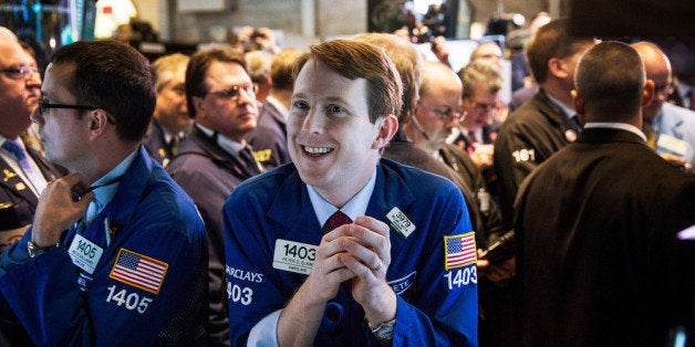 NEW YORK, NY - NOVEMBER 07: Traders on the floor of the New York Stock Exchange (NYSE) work as Twitter's initial price offe