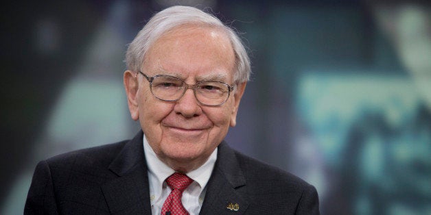 Warren Buffett, chairman and chief executive officer of Berkshire Hathaway Inc., smiles during an interview in New York, U.S., on Tuesday, Oct. 22, 2013. Warren Buffett and his late first wife, Susan, gave and pledged billions to each of their three children to fund charitable foundations. Howard, an Illinois farmer, picked global hunger as his target. Photographer: Scott Eells/Bloomberg via Getty Images 