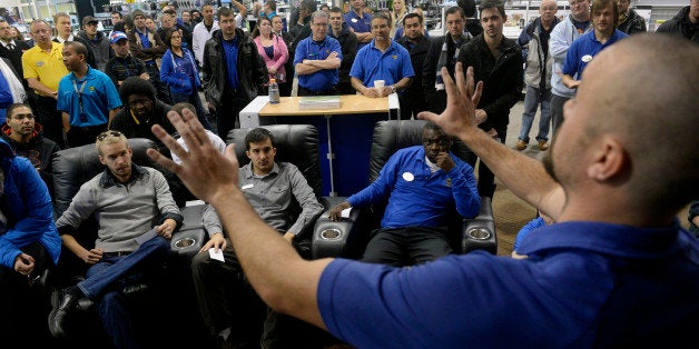 DENVER, CO. - NOVEMBER 23: General Manager Doug Ryan, right, prepares his staff for a Black Friday rehearsal at Best Buy in Denver, CO November 23, 2013. Employees practiced Black Friday scenarios, managing crowds and organizing lines. Sales Manager Kevin Ribbens said it is especially useful for employees that have never worked on the busiest shopping day of the year. (Photo By Craig F. Walker / The Denver Post)