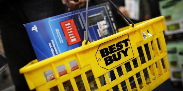 NAPLES, FL - NOVEMBER 23: Shoppers move through a Best Buy store on November 23, 2012 in Naples, Florida. Although controversial, many big retail stores have again decided to get a head start this year for Black Friday and open on Thanksgiving Day or at midnight instead of the traditional dawn Friday opening time. Black Friday is the official start of the holiday shopping season and the busiest shopping day of the year form many retailers. (Photo by Spencer Platt/Getty Images)