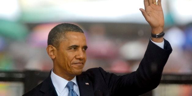 JOHANNESBURG, SOUTH AFRICA - DECEMBER 10: (SOUTH AFRICA OUT)US President Barak Obama attending Nelson Mandela's public Memorial Service at the FNB stadium on December 10, 2013, in Johannesburg, South Africa. The Father of the Nation passed away quietly on the evening of December 5, 2013 at his home in Houghton with family. He will be buried in Qunu for the official State funeral on December 15, 2013. (Photo by Herman Verwey/Foto24/Gallo Images/Getty Images)