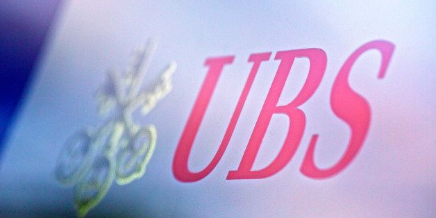A logo sits on a sign outside a UBS AG bank branch in Lausanne, Switzerland, on Monday, Oct. 21, 2013. UBS AG, Switzerland's largest lender, became Asia-Pacific's biggest private bank by assets in 2012, regaining the top ranking it ceded to Citigroup Inc. the previous year in a study by Private Banker International. Photographer: Gianluca Colla/Bloomberg via Getty Images