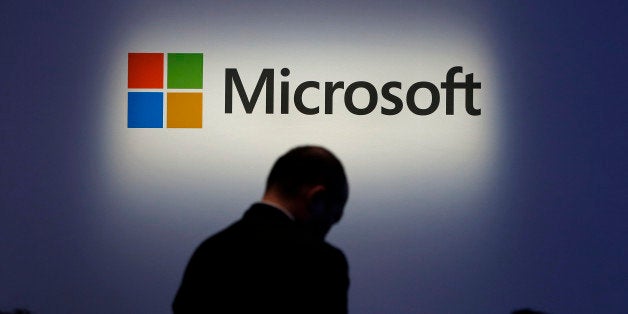 The Microsoft Corp. logo is displayed at a launch event for the company's Windows 8.1 operating system in Tokyo, Japan, on Fr