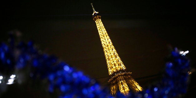 Photo taken on December 24, 2013 shows the Eiffel Tower in Paris. AFP PHOTO / KENZO TRIBOUILLARD (Photo credit should
