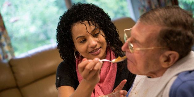 Home-care aide Malrissa Perkins feeds Alan B. Smith, 81, in Lincoln, Massachusetts, U.S., on Thursday, June 13, 2013. The number of personal care aides will increase 70 percent between 2010 and 2020, making it the fastest-growing job in the country, according to the U.S. Department of Labor. Photographer: Scott Eells/Bloomberg via Getty Images 