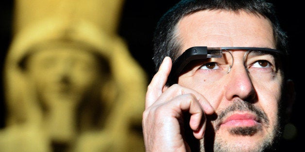 A man tests a pair of Google glasses equiped with LIS (Italian Sign Language - 'Linguaggio Italiano dei Segni') capabilities and created to help deaf people during their visit of the Egyptian Museum in Turin, on November 11, 2013. The Museum of Egyptian Antiquity ('Museo delle Antichite Egizie') in Turin is dedicated solely to Egyptian art and culture, and it is the first museum of its kind to use the interactive glasses to assist deaf people during their visit. An actor using sign language is projected onto the small video screen integrated into the glasses, thereby providing historical information and explanations to deaf visitors throughout the exhibition. AFP PHOTO / GIUSEPPE CACACE (Photo credit should read GIUSEPPE CACACE/AFP/Getty Images)