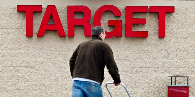 A workman pushes a cart of plumbing supplies into a Target Corp. store in Peru, Illinois, U.S., on Thursday, Feb. 7, 2013. Target Corp. led U.S. retailers to the biggest monthly same-store sales gain in more than a year as shoppers snapped up discounted merchandise chains were clearing out after the holidays. Photographer: Daniel Acker/Bloomberg via Getty Images