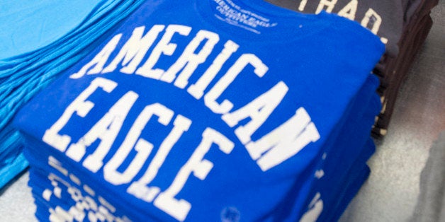 Employee Marcus Mullins arranges shirts at an American Eagle Outfitters Inc. store in San Francisco, California, U.S., on Wednesday, March 6, 2013. American Eagle reported adjusted fiscal year 2012 earnings for the 53 weeks ended February 2, 2013 of $1.39 per share, a 43% increase from fiscal year 2011 adjusted earnings. Photographer: David Paul Morris/Bloomberg via Getty Images