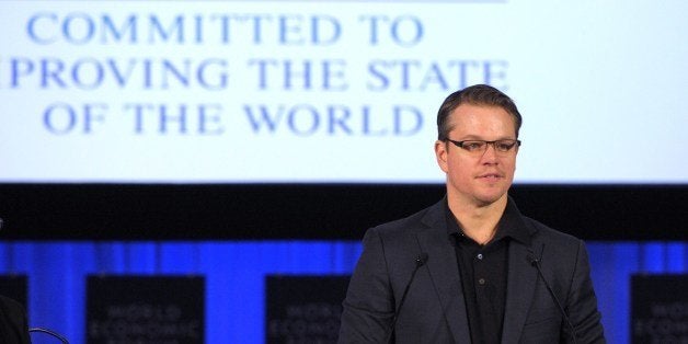 US actor and co-founder of Water.org, Matt Damon, addresses the audience prior to receive a World Economic Forum's Crystal Award during a ceremony on the eve of the opening of the forum in Davos on January 21, 2014. Some 40 world leaders gather in the Swiss ski resort Davos to discuss and debate a wide range of issues including the causes of conflicts plaguing the Middle East and how to reinvigorate the global economy. AFP PHOTO ERIC PIERMONT (Photo credit should read ERIC PIERMONT/AFP/Getty Images)