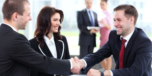 business people shaking hands ...