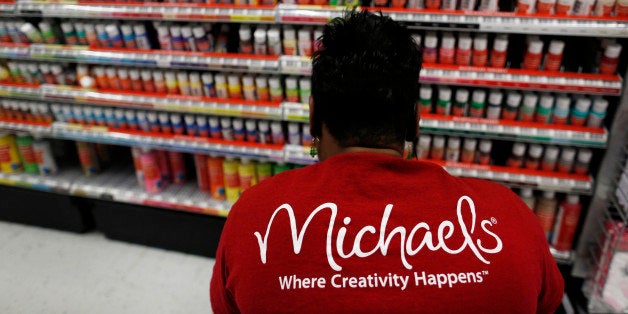Employee Nikki Bush stocks acrylic paint at a Michaels Stores Inc. location in Cincinnati, Ohio, U.S., on Monday, Dec. 9, 2013. Michaels Stores Inc. offers arts, crafts, scrapbooking, floral, framing, home decor, seasonal offerings, and children's hobbies, as well as provides photo frames, ready-made frames, art prints, framed arts, art supplies, and custom framing services. Photographer: Luke Sharrett/Bloomberg via Getty Images