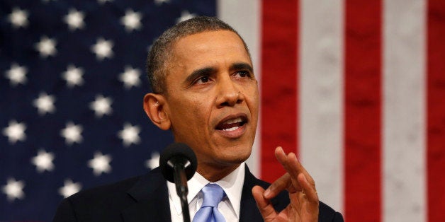 US President Barack Obama delivers the State of the Union address at the US Capitol in Washington on January 28, 2014. AFP PHOTO/Larry DOWNING/Pool (Photo credit should read LARRY DOWNING/AFP/Getty Images)