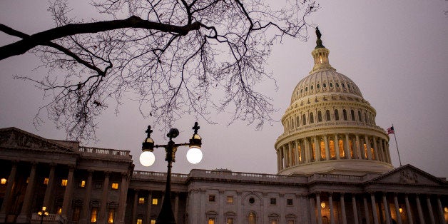 The Capitol building stands at dusk before U.S. President Barack Obama delivers the State of the Union address to a joint session of Congress in Washington, D.C., U.S., on Tuesday, Jan. 28, 2014. Obama tonight will say the U.S. must break the economic stagnation of lower- and middle-income Americans, calling on Congress to work with him on 'concrete, practical proposals' while vowing to act on his own wherever he can. Photographer: Pete Marovich/Bloomberg via Getty Images