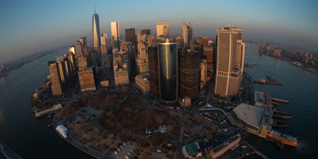 The downtown Manhattan skyline stands in this aerial photograph taken in New York, U.S., on Tuesday, Dec. 3, 2013. U.S. stocks declined a fifth day, sending the Standard & Poors 500 Index to a two-week low, after improving economic data boosted bets the Federal Reserve will curb its monthly bond purchases sooner than estimated. Photographer: Ron Antonelli/Bloomberg via Getty Images