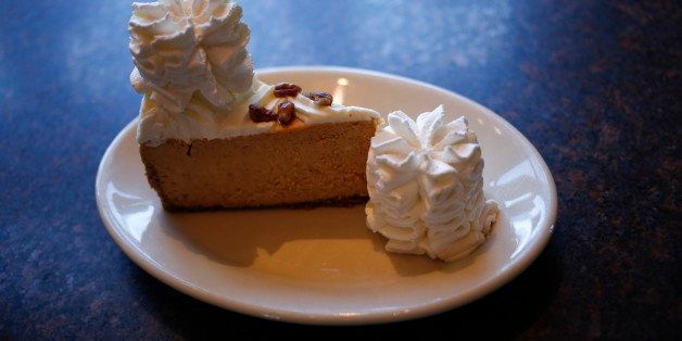 A slice of pumpkin cheesecake is arranged for a photograph at a Cheesecake Factory Inc. restaurant in Louisville, Kentucky, U.S., on Wednesday, Nov. 13, 2013. Last month The Cheesecake Factory Inc. reported total revenues of $469.7 million in the third quarter of fiscal 2013 as compared to $453.8 million in the prior year third quarter. Photographer: Luke Sharrett/Bloomberg via Getty Images