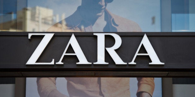 A logo sits on display above the entrance to a Zara retail store, operated by Inditex SA, in Barcelona, Spain, on Tuesday, Ap