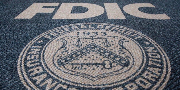 UNITED STATES - SEPTEMBER 09: The Federal Deposit Insurance Corp. logo is displayed outside of the agency's headquarters in Washington, D.C., U.S., on Wednesday, Sept. 9, 2009. The FDIC proposed a six-month, emergency-only extension to its debt guarantee program as regulators move to wean companies from federal aid approved at the height of last year's credit crisis. (Photo by Andrew Harrer/Bloomberg via Getty Images)