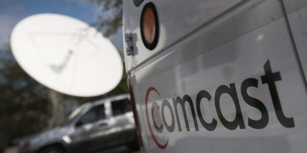 POMPANO BEACH, FL - FEBRUARY 13: A Comcast truck is seen parked at one of their centers on February 13, 2014 in Pompano Beac
