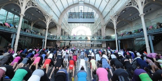 LONDON, ENGLAND - MARCH 08: Lululemon athletica host a 400 person Yoga Class at the Royal Opera House in Covent Garden to celebrate their first London store opening on the 28th of March on March 8, 2014 in London, England. (Photo by Stuart C. Wilson/Getty Images for lululemon athletica)