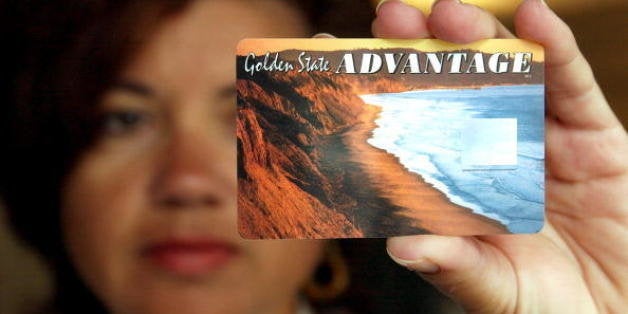 OAKLAND, CA - JULY 17: Deborah McFadden holds a sample of the new California State Electronic Benefit Transfer (EBT) card July 17, 2002 in Oakland, California. On August 1, Alameda county will be one of two counties in California to pilot the EBT system for distribution of Food Stamps, CalWORKs and General Assistance benefits. (Photo by Justin Sullivan/Getty Images) 