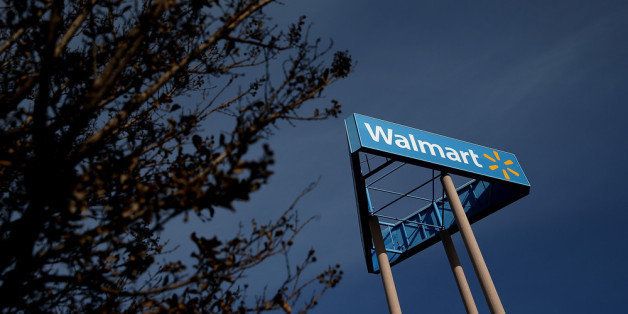 SAN LORENZO, CA - FEBRUARY 20: A sign is posted outside of a Wal-Mart store on February 20, 2014 in San Lorenzo, California. Wal-Mart reporterd a 21 percent decline in fourth quarter earnings with profits of $4.4 billion or $1.36 a share compared to $5.6 billion, or $1.67 per share one year ago. (Photo by Justin Sullivan/Getty Images)