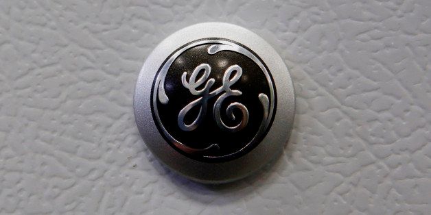 The General Electric Co. (GE) logo is seen on a refrigerator displayed for sale at a Lowe's Cos. store in Torrance, California, U.S, on Thursday, Oct. 17, 2013. General Electric Co. is scheduled to release earnings figures on Oct. 18. Photographer: Patrick T. Fallon/Bloomberg via Getty Images