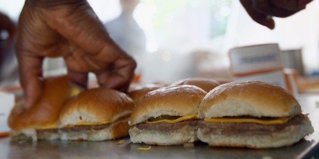 WASHINGTON, DC - JUNE 14: White Castle employees cook their slider burgers before delivering them at the U.S. Capitol to cel