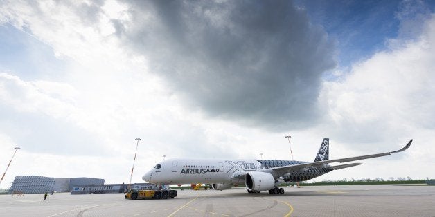 The new Airbus A350 XWB stands on the production premisses of the European aircraft manufacturing company Airbus in Hamburg, northern Germany on April 07, 2014. Airbus presented the interior of its future A350 which - according to the company - will offer 'more personal space, flexibility and comfort' than other aircrafts in its class. AFP PHOTO / PATRICK LUX (Photo credit should read PATRICK LUX/AFP/Getty Images)