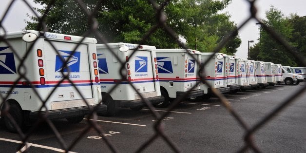 (FILES)US Postal Service mail delivery trucks sit idle at the Manassas Post Office in Virginia on September 5, 2011.The US Postal Service unveiled September 15, 2011 a drastic downsizing scheme for the embattled public company, including cutting 35,000 jobs, as it seeks to avoid collapse amid a 'new reality' in the economy. 'Faced with a massive nationwide infrastructure that is no longer financially sustainable,' the USPS said it was proposing sweeping changes aimed at saving the organization up to $3 billion a year. AFP PHOTO/Karen BLEIER / FILES (Photo credit should read KAREN BLEIER/AFP/Getty Images)