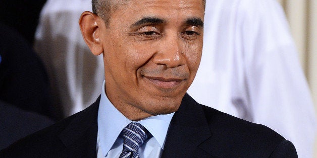 US President Barack Obama smiles before speaking on his My Brothers Keeper initiative in the East Room at the White House on February 27, 2014 in Washington, DC. Obama launched a passionate appeal to improve opportunities for minority youths, saying their plight was an 'outrage' that could easily have become his story. Obama cited statistics showing young Blacks and Hispanics in the US were, on average, disadvantaged throughout their lives. AFP PHOTO/Jewel Samad (Photo credit should read JEWEL SAMAD/AFP/Getty Images)