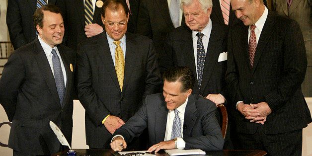 BOSTON - APRIL 12: At Faneuil Hall, Gov. Mitt Romney signed a health care bill, with many political figures present. Front row, from left to right: Timothy Murphy, Massachusetts Health & Human Services Secretary; Robert E. Travaglini, Senate President, Sen. Edward M. Kennedy, Lt. Gov. Kerry Healey and Salvatore DiMasi, Speaker of Mass. State House of Representatives. (Photo by David L Ryan/The Boston Globe via Getty Images)