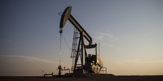 WILLISTON, ND - JULY 22: A pumpjack is seen on July 22, 2013 outside Williston, North Dakota. Pumpjacks are used to mechanically pump oil and natural gas out of the earth when there is not enough natural pressure for the liquids to rise on their own. North Dakota has been experiencing an oil boom recently, brining tens of thousands of jobs to the region, lowering state unemployment and bringing a surplus to the state budget. (Photo by Andrew Burton/Getty Images)