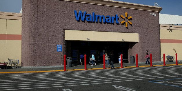 SAN LORENZO, CA - FEBRUARY 20: Customers enter a Wal-Mart store on February 20, 2014 in San Lorenzo, California. Wal-Mart reporterd a 21 percent decline in fourth quarter earnings with profits of $4.4 billion or $1.36 a share compared to $5.6 billion, or $1.67 per share one year ago. (Photo by Justin Sullivan/Getty Images)
