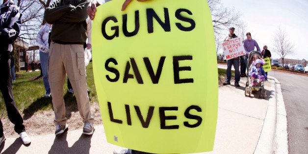 ROMULUS, MI - APRIL 27: A supporter of Michigan's Open Carry law attends a rally and march April 27, 2014 in Romulus, Michigan. The march was held to attempt to demonstrate to the general public what the typical open carrier is like. (Photo by Bill Pugliano/Getty Images)