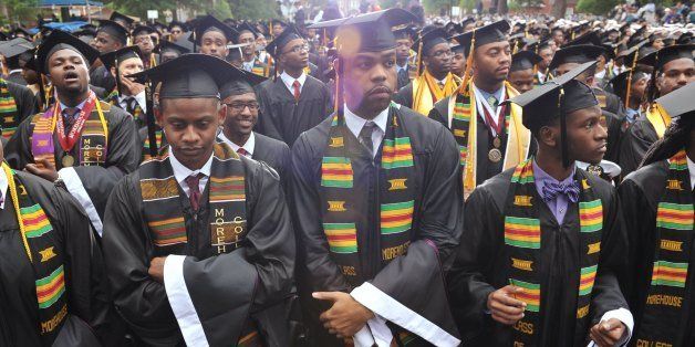 Members of the graduation class of 2013 stand during the commencement ceremony before US President Barack Obama delivers the key address at Morehouse College on May 19, 2013 in Atlanta, Georgia. AFP PHOTO/Mandel NGAN (Photo credit should read MANDEL NGAN/AFP/Getty Images)