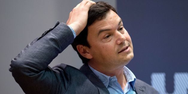 French economist Thomas Piketty speaks to students and guests during a presentation at King's College, central London, on April 30, 2014. Piketty said that he hoped to create a 'more informed fight' about the issue of income inequality as he launched his bestselling and highly controversial book in Britain. AFP PHOTO / LEON NEAL (Photo credit should read LEON NEAL/AFP/Getty Images)