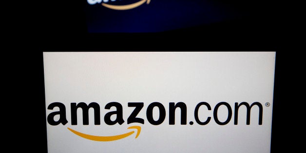 The Amazon.com Inc. and Amazon Kindle logos are displayed on laptop computers in Washington, D.C., U.S., on Wednesday, Oct. 2