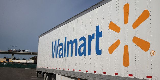 SAN LORENZO, CA - FEBRUARY 20: A Wal-Mart truck sits outside of a Wal-Mart store on February 20, 2014 in San Lorenzo, California. Wal-Mart reporterd a 21 percent decline in fourth quarter earnings with profits of $4.4 billion or $1.36 a share compared to $5.6 billion, or $1.67 per share one year ago. (Photo by Justin Sullivan/Getty Images)