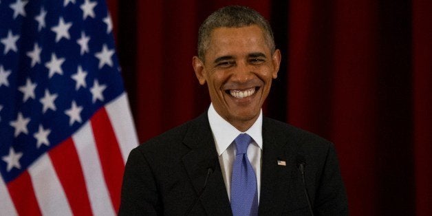 US President Barack Obama smiles as he answers questions during a joint press conference at Seri Perdana in Malaysia's administrative capital of Putrajaya on April 27, 2014. Obama paid homage to Malaysia's moderate brand of Islam and picked his way through his hosts' contentious politics on April 27 on the latest leg of his Asian tour. AFP PHOTO / MOHD RASFAN (Photo credit should read MOHD RASFAN/AFP/Getty Images)