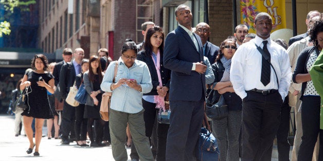 Job seekers line up outside at Choice Career Fairs' New York career fair at the Holiday Inn Midtown in New York, U.S., on Tuesday, May 13, 2014. The U.S. Department of Labor is scheduled to release initial and continuing jobless claims data on May 15. Photographer: Craig Warga/Bloomberg via Getty Images