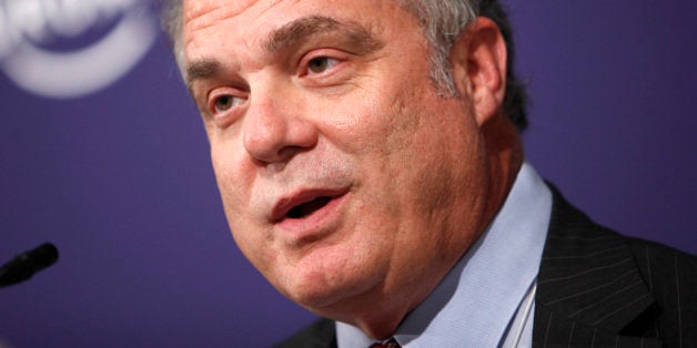 Mark Bertolini, chairman president and chief executive officer of Aetna Inc., speaks during a news conference at the World Ec