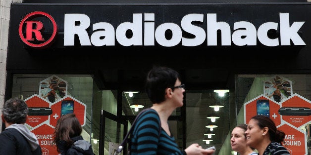SAN FRANCISCO, CA - MARCH 04: People walk by a Radio Shack store on March 4, 2014 in San Francisco, California. RadioShack announced plans to close over 1,000 of its underperforming stores, approximately 20 percent of its retail locations, as part of a restructuring to be more competitive in retail electronics. (Photo by Justin Sullivan/Getty Images)