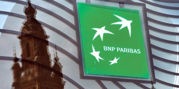 A photo taken on June 24, 2014 in Lille, northern France shows the logo of the French bank BNP Paribas. US regulators next week plan to announce a $9 billion settlement with BNP Paribas to settle charges the French bank violated American sanctions, a person familiar with the talks said today. After lengthy negotiations, the big French bank, the US Department of Justice and New York state banking regulator Benjamin Lawsky have reached a broad agreement on a settlement, said the person, who spoke on the condition of anonymity. AFP PHOTO / PHILIPPE HUGUEN (Photo credit should read PHILIPPE HUGUEN/AFP/Getty Images)